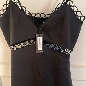 Beautiful black midi cocktail dress. Brand new with tags. Size 4 US.